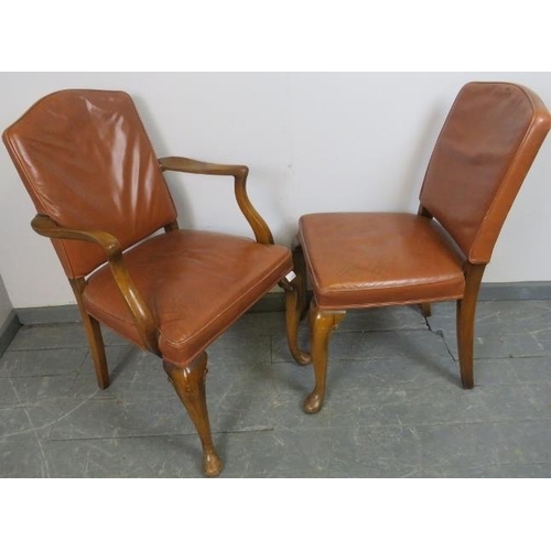 815 - A pair of antique walnut His and Hers desk chairs, one a carver, upholstered in distressed tan leath... 