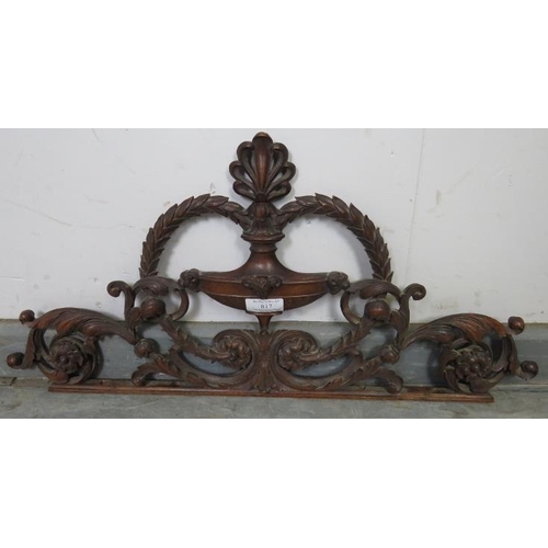 817 - A well carved 19th century mahogany cornice depicting a laurel wreath amidst acanthus scrolls and a ... 