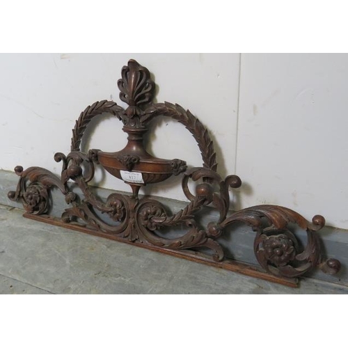 817 - A well carved 19th century mahogany cornice depicting a laurel wreath amidst acanthus scrolls and a ... 