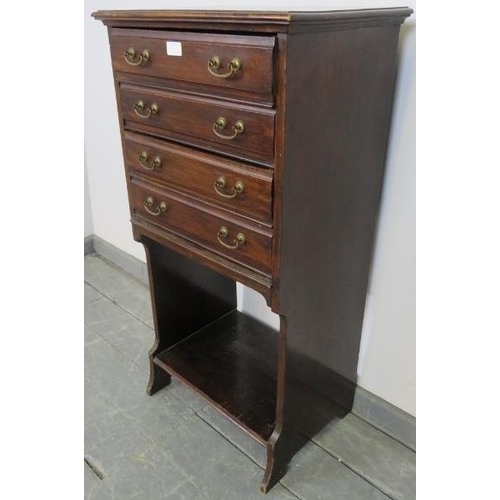 819 - An Edwardian mahogany music cabinet, the four long drawers with hinged fronts and gilt brass handles... 