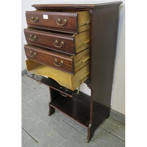 819 - An Edwardian mahogany music cabinet, the four long drawers with hinged fronts and gilt brass handles... 