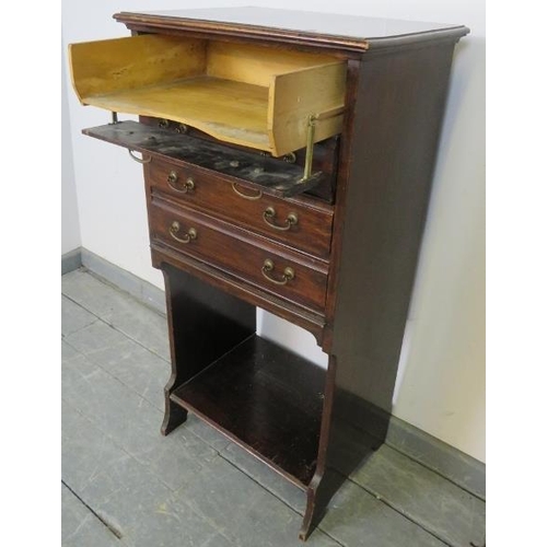 819 - An Edwardian mahogany music cabinet, the four long drawers with hinged fronts and gilt brass handles... 