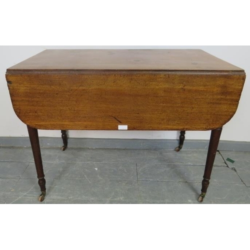 821 - An early Victorian mahogany Pembroke table, with reeded edge, single drawer and dummy drawer on tape... 