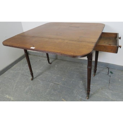 821 - An early Victorian mahogany Pembroke table, with reeded edge, single drawer and dummy drawer on tape... 