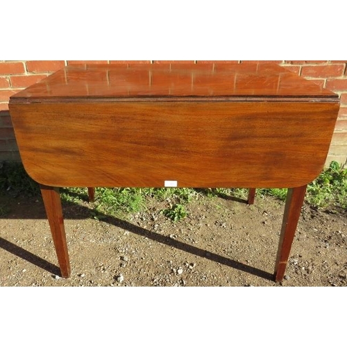 828 - A Georgian mahogany Pembroke table, with single drawer and dummy drawer, on tapering square supports... 