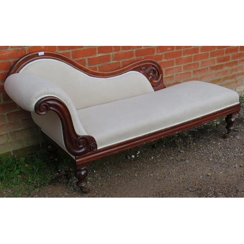 830 - A Victorian mahogany show-wood chaise longue, with scrolled and pierced backrest, reupholstered in a... 