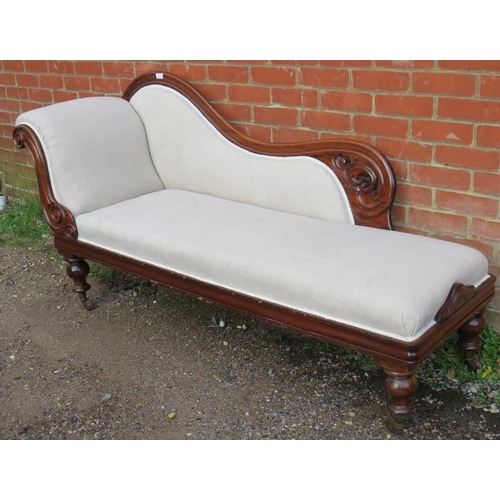 830 - A Victorian mahogany show-wood chaise longue, with scrolled and pierced backrest, reupholstered in a... 