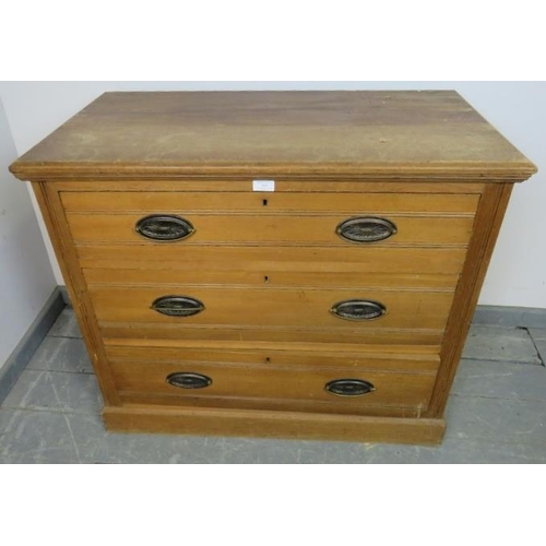 832 - A small Edwardian satin walnut chest of three long drawers with pressed brass handles, on a plinth b... 