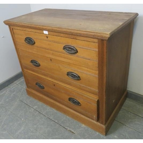 832 - A small Edwardian satin walnut chest of three long drawers with pressed brass handles, on a plinth b... 