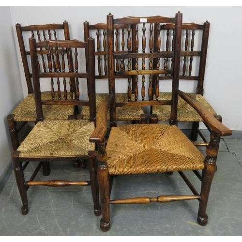 834 - Five (4+1) 19th century oak Lancashire spindle back chairs with rush seats, on turned front supports... 