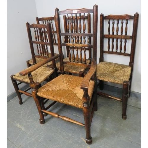 834 - Five (4+1) 19th century oak Lancashire spindle back chairs with rush seats, on turned front supports... 