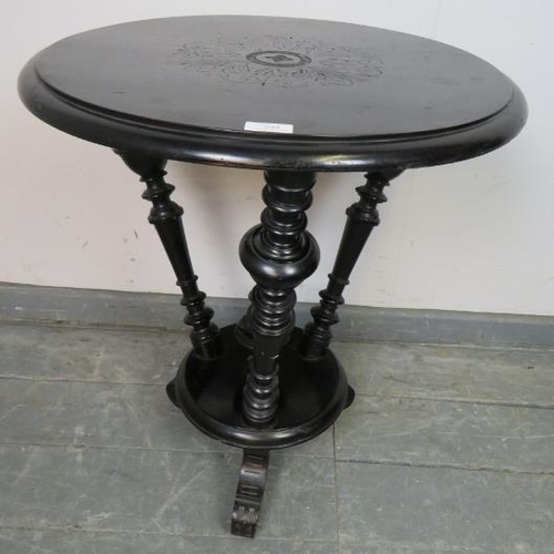 840 - An Aesthetic Movement ebonised circular occasional table, with three canted turned uprights and cent... 