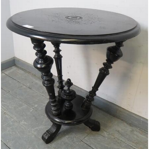 840 - An Aesthetic Movement ebonised circular occasional table, with three canted turned uprights and cent... 