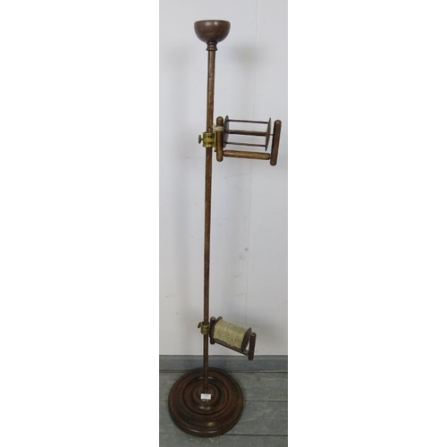 844 - A turn of the century oak freestanding wool winder, with pin tray finial and height adjustable spool... 