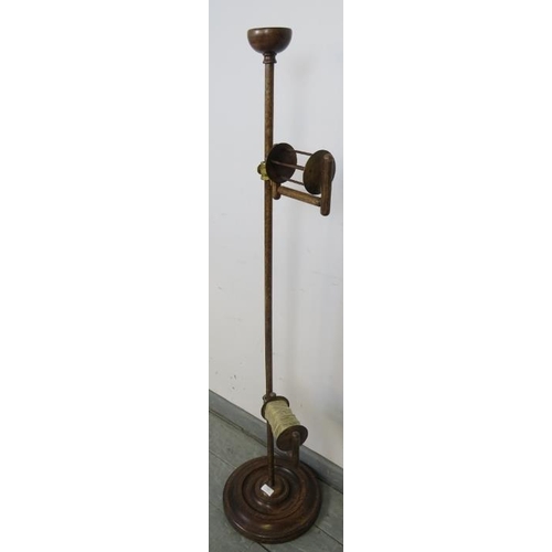 844 - A turn of the century oak freestanding wool winder, with pin tray finial and height adjustable spool... 