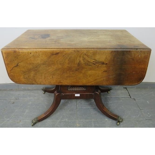 847 - A Regency Period mahogany drop leaf supper table, with single drawer and dummy drawer, on a square p... 