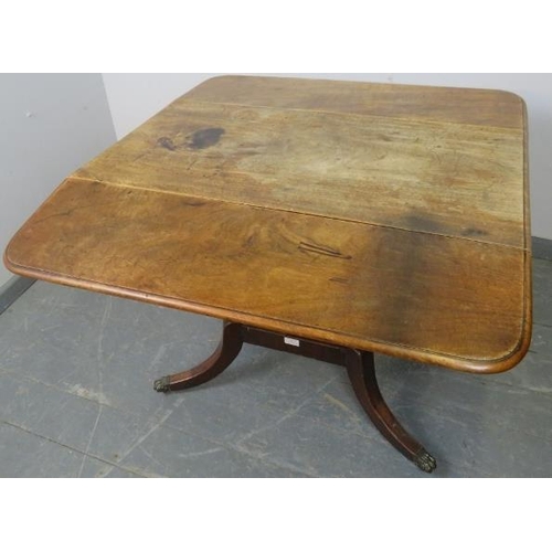 847 - A Regency Period mahogany drop leaf supper table, with single drawer and dummy drawer, on a square p... 