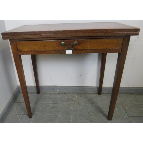 851 - A Georgian mahogany turnover tea table, the single drawer with reeded edge and brass swan neck handl... 