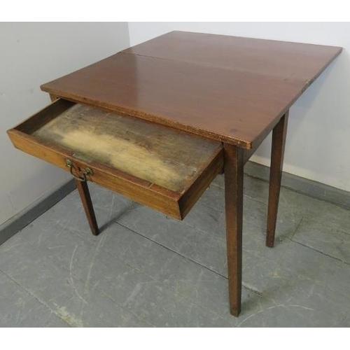 851 - A Georgian mahogany turnover tea table, the single drawer with reeded edge and brass swan neck handl... 