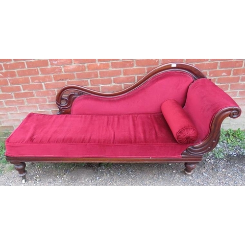 855 - A Victorian mahogany show-wood chaise longue, with scrolled and pierced backrest, upholstered in cri... 