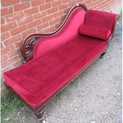 855 - A Victorian mahogany show-wood chaise longue, with scrolled and pierced backrest, upholstered in cri... 