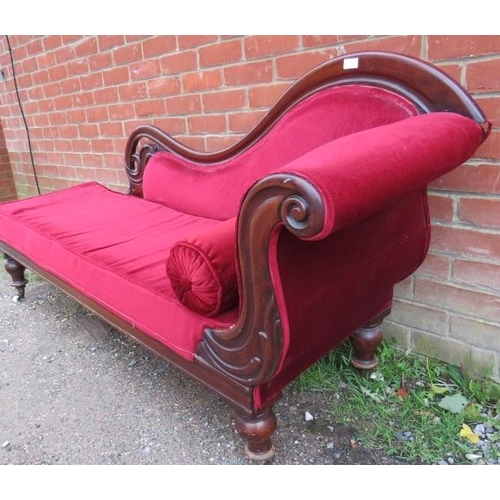 855 - A Victorian mahogany show-wood chaise longue, with scrolled and pierced backrest, upholstered in cri... 