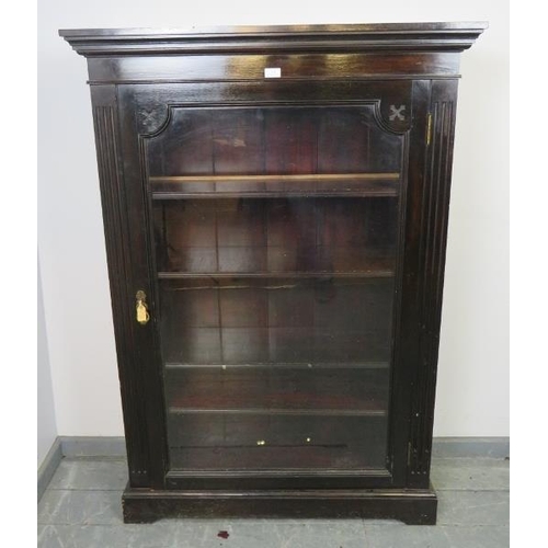 858 - A Victorian mahogany ebonised glazed bookcase, flanked by reeded columns, housing four height adjust... 