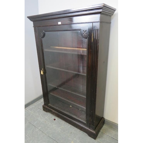 858 - A Victorian mahogany ebonised glazed bookcase, flanked by reeded columns, housing four height adjust... 