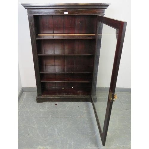 858 - A Victorian mahogany ebonised glazed bookcase, flanked by reeded columns, housing four height adjust... 