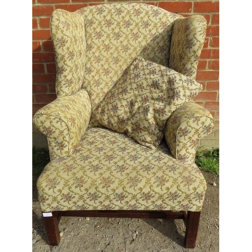 859 - A Georgian Revival wingback armchair, upholstered in a tapestry material with matching loose cushion... 