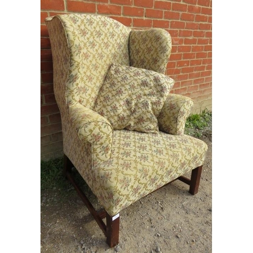 859 - A Georgian Revival wingback armchair, upholstered in a tapestry material with matching loose cushion... 