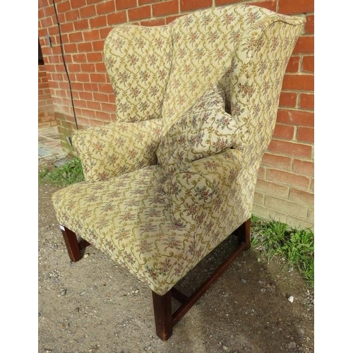 859 - A Georgian Revival wingback armchair, upholstered in a tapestry material with matching loose cushion... 