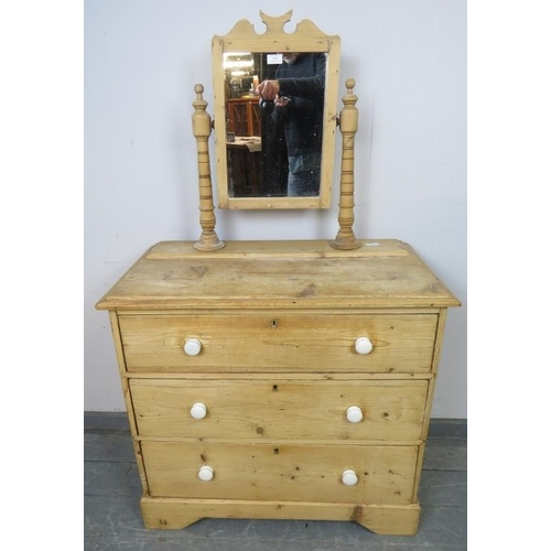 861 - A Victorian stripped pine dressing chest, the swing mirror on turned uprights with finials, above th... 