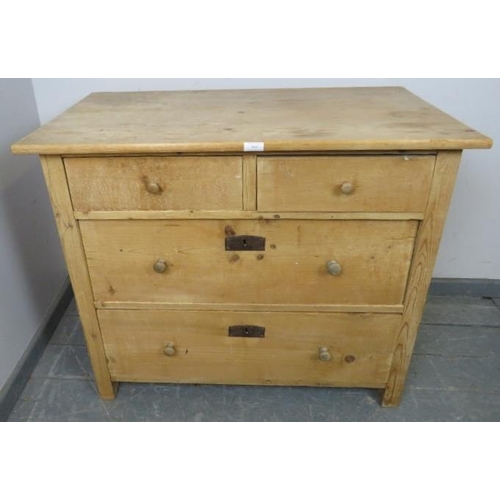 863 - An Edwardian stripped pine chest of two short over two long graduated drawers with turned knob handl... 