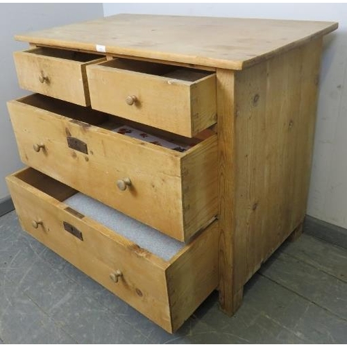 863 - An Edwardian stripped pine chest of two short over two long graduated drawers with turned knob handl... 