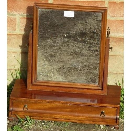 867 - A Georgian mahogany swing vanity mirror with brass finials, above a box base with single drawer, on ... 