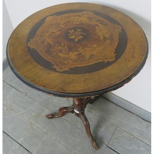 869 - A 19th century walnut circular occasional table, featuring marquetry inlay, on a spiral carved taper... 