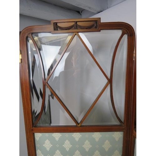 870 - An Edwardian mahogany three-section dressing screen strung with satinwood, featuring bevelled glass ... 