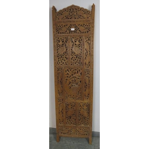 871 - A vintage hardwood Eastern four-section folding screen, with carved and pierced decoration depicting... 