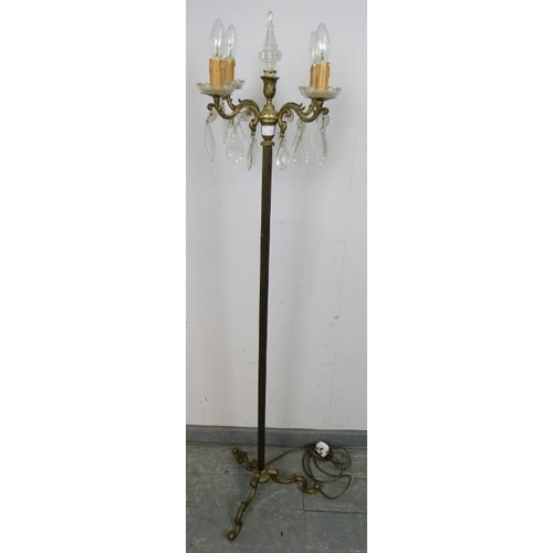 879 - A vintage floorstanding gilt brass four branch candelabra lamp, featuring cut glass finial and hangi... 