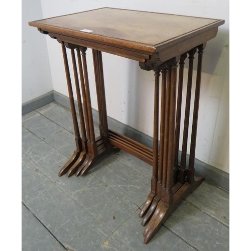 887 - An Edwardian mahogany quartetto of nesting tables, crossbanded and strung with ebony and satinwood, ... 