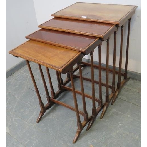 887 - An Edwardian mahogany quartetto of nesting tables, crossbanded and strung with ebony and satinwood, ... 