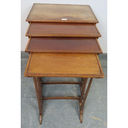 887 - An Edwardian mahogany quartetto of nesting tables, crossbanded and strung with ebony and satinwood, ... 