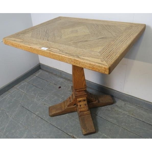 888 - A vintage light oak pedestal table, on a tapering square pedestal with quatreform base. 
Condition r... 