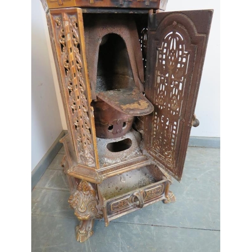 895 - An antique French cast iron treacle glaze enamel multi-fuel stove by Poeles Nanquette St. Michel, wi... 