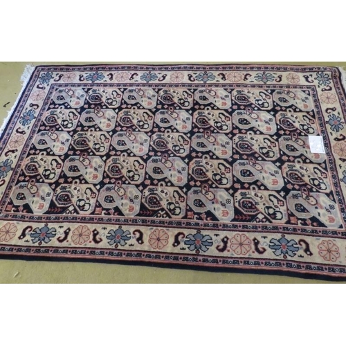 901 - A late 20th century wool rug with a repeat pattern to central field, blue/cream. 200cm x 121cm. Very... 