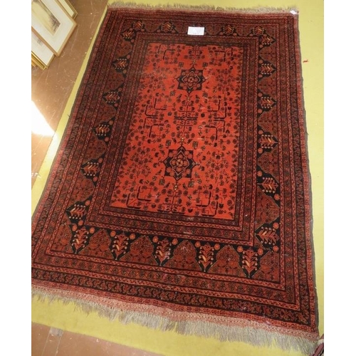 902 - A mid 20th century Persian rug central pattern on burnt umber field with wide borders, 180cm x 127cm... 