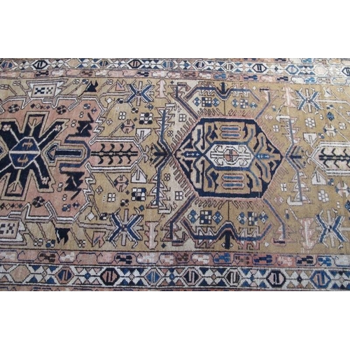 909 - North West Persian Heriz runner, very patterned rug in pale muted colours, good condition. 300cm x 1... 