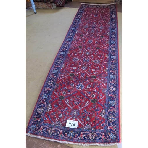 916 - North West Persian Sarouk runner. Central foliage on claret ground and repeat blue border. Good colo... 