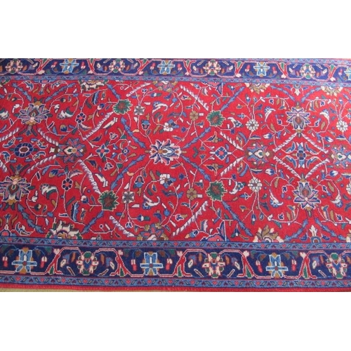 916 - North West Persian Sarouk runner. Central foliage on claret ground and repeat blue border. Good colo... 